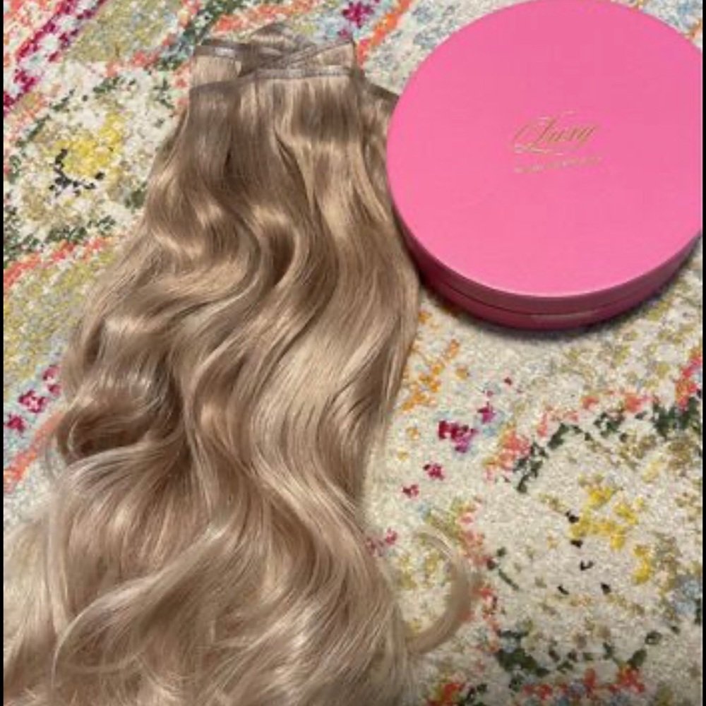 LUXY brand 20” seamless natural blonde balayage clip-in hair extensions.